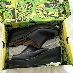 Fly London Black slides size 42 (fits US10 women). In very good condition.